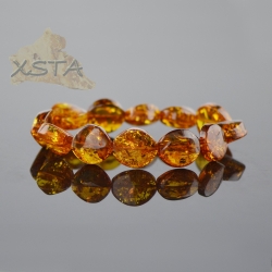 Amber bracelet with cognac color beads